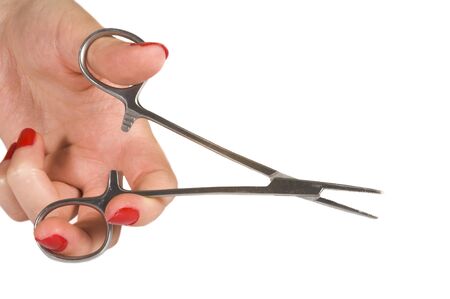 isolated forceps in girl hand on white backgroundの写真素材