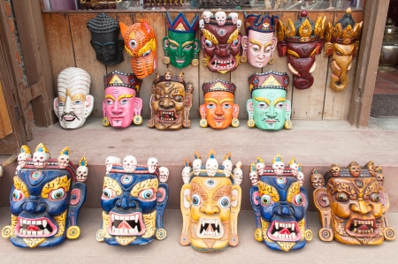Traditional Buddhist festival masks on a shop windowの写真素材