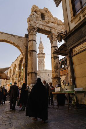 DAMASCUS, SYRIA - NOVEMBER 16, 2012: Umayyad Mosque minaret and ruins from Al-Hamidiyah Souq in the old city of Damascus. The Minaret of Qaitbay was constructed in 1488 on the orders of Mamluk sultan Qaitbayのeditorial素材