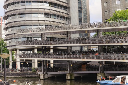 AMSTERDAM, NETHERLANDS - JUNE  12, 2012: Multiple storey bicycles parking place in Amsterdam. Bicycle parking is always a concern, especially in cities where there are lots of bikes.のeditorial素材