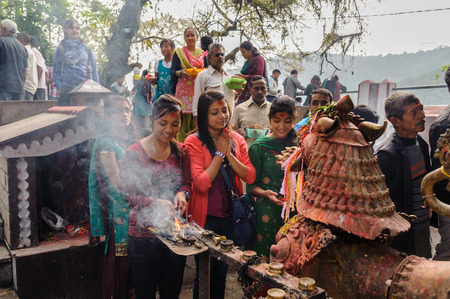 POKHARA, NEPAL - OCTOBER 29, 2011: View of praying people at Taal Barahi Mandir-hindu temple devoted...