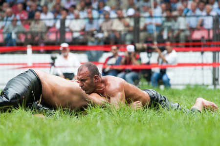 EDIRNE, TURKEY - JULY 26, 2010: Wrestlers Turkish pehlivan at the competition in traditional Kirkpinar wrestling. Kirkpinar is a Turkish oil-wrestling (Turkish: yagli gures) tournament.のeditorial素材