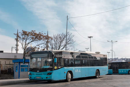 Eminonu, Istanbul, Turkey - 02.18.2021: a blue bus parked in bus depot in coastal area of Eminonu with copy spaceのeditorial素材