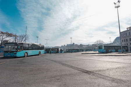 Eminonu, Istanbul, Turkey - 02.18.2021: wide view of Istanbul bus depot and blue buses parked around under blue sky with copy spaceのeditorial素材