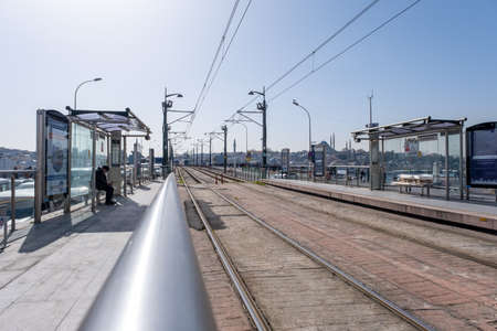 Karakoy, Istanbul, Turkey - 02.26.2021: Karakoy tram station and passengers wait for the tram coming tram interior and transportation concept with copy spaceのeditorial素材