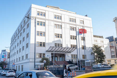 Eminonu, Istanbul, Turkey - 02.26.2021: Istanbul Chamber of Commerce central building and crowd...