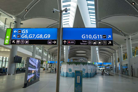 Arnavutkoy, Istanbul, Turkey - 03.08.2021: tables showing airport gates and saloons in large Istanbul Airport for passengersのeditorial素材