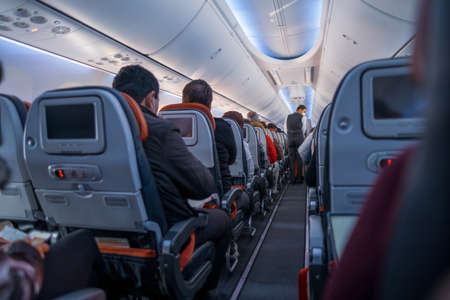 Arnavutkoy, Istanbul, Turkey - 03.08.2021: steward with protective mask service on air travel and...