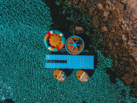 Aerial drone bird eye view of water sports in blue lagoon in Cyprus. Konnos Beachの写真素材