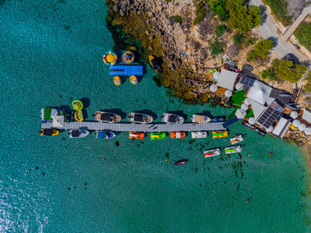 Aerial drone bird eye view of water sports in blue lagoon in Cyprus. Konnos Beachの写真素材
