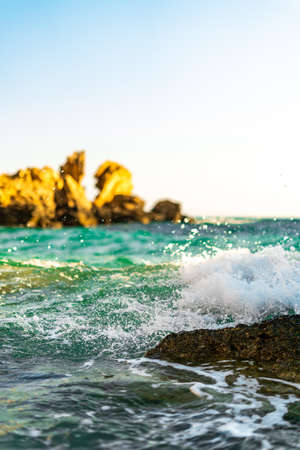 Photo of rocky coastline with blue water and waves in Mediterranean sea in Cyprusの写真素材