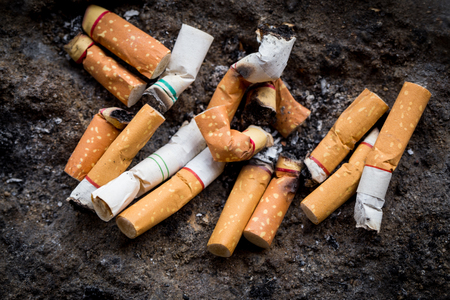World No Tobacco Day.Cigarette butts on a gray background / cigarette butts / cigaretteの写真素材