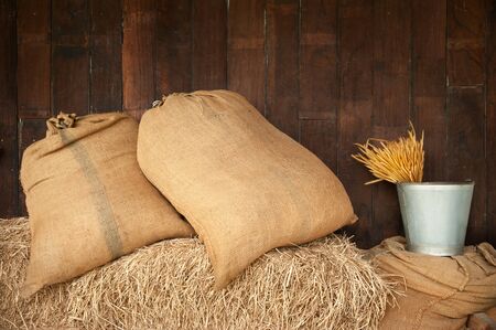 sack put one the stack of rice strawの写真素材