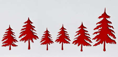 red christmas trees with punch paper design is on white background with drawing textureの写真素材