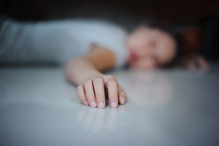 concept the women fall down on the floor close up at the hand