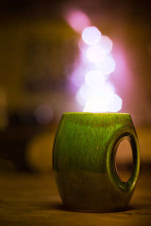 Cup with lights coming out acting as steam.の写真素材