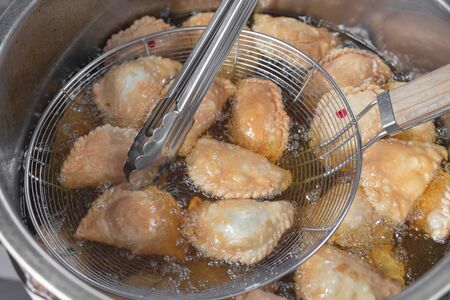 Curry puff on a white plate. Curry puff, snack food, pastries, stuffed buns.の写真素材