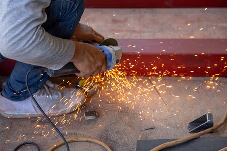 Worker welding steel with sparks using mig mag welderの写真素材