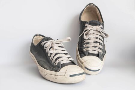 sneakers dirty isolated on white background, Footwear for outdoor activities, clipping path done using pen toolの写真素材