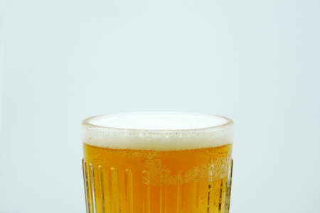 Full beer glass, A glass of cold beer macro photography, cool beer objectの写真素材