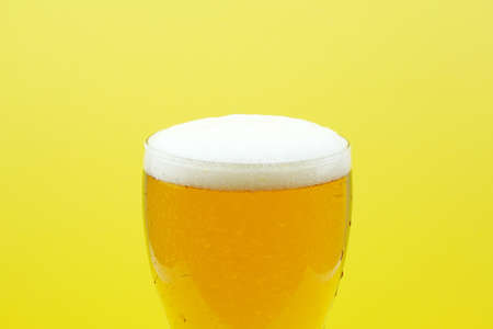 Full beer glass, A glass of cold beer macro photography, cool beer objectの写真素材