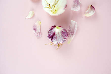 Fresh garlic, Delicious garlic isolated on color backgroundの写真素材