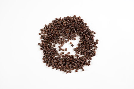 brown roasted coffee beans and coffee cupの写真素材