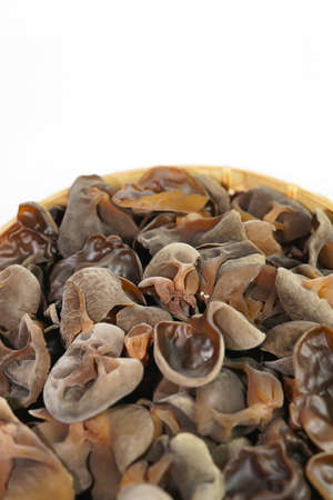 Fresh wood ear nushroom on white background,raw material for cooking. Close up.の写真素材