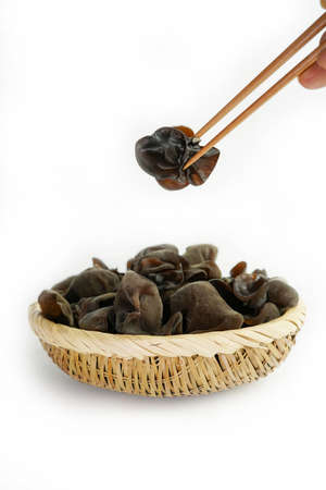 Fresh wood ear nushroom on white background,raw material for cooking. Close up.の写真素材