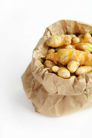 Fresh turmeric on white background,raw material for cooking. Close up.の写真素材