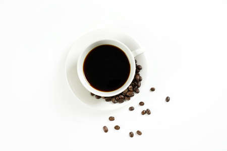 brown roasted coffee beans and coffee cupの写真素材