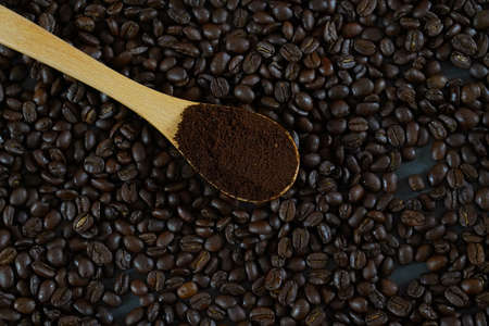 brown roasted coffee beans and coffee cupの写真素材