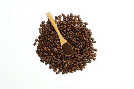 brown roasted coffee beans and coffee cupの写真素材