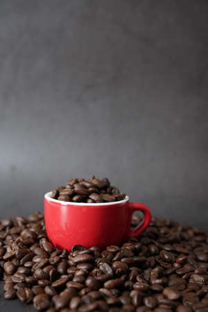 brown roasted coffee beans and coffee cupの写真素材
