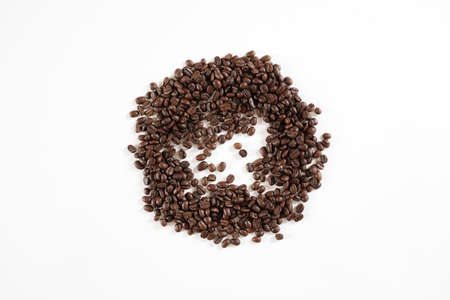 brown roasted coffee beans and coffee cupの写真素材