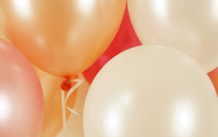 Colorful balloons background, Many blown balloons on wall,Bunch of balloons isolated on backgroundの写真素材