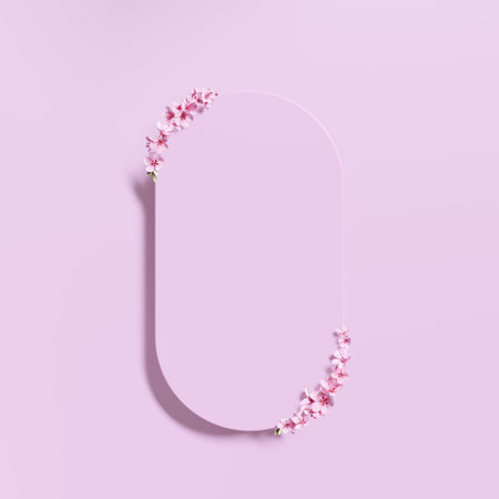 Blank sign with pink cherry blossom petals on pastel backgroundの写真素材