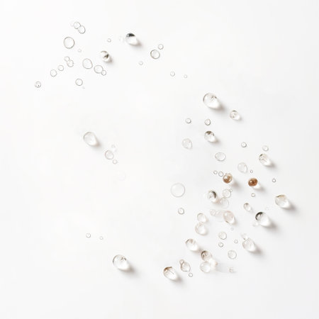 Pearl drops on white background. Flat lay, top view.の素材