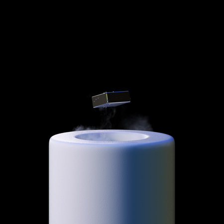 3d render levitating neodymium magnet. A levitating magnet over a superconductor filled with liquid nitrogenの写真素材