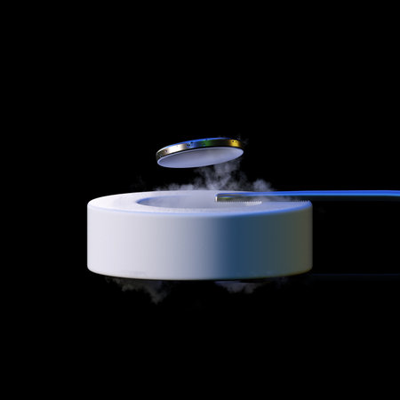 3d render levitating neodymium magnet. A levitating magnet over a superconductor filled with liquid nitrogenの写真素材