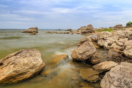 Small waves hit lightly the shore