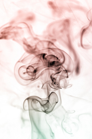 colorful smoke on dark backgroundの写真素材