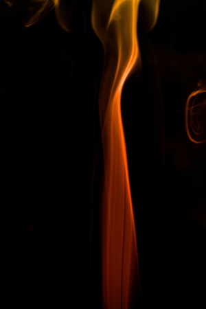 colorful smoke on dark backgroundの写真素材