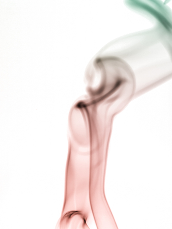 colorful smoke on dark backgroundの写真素材