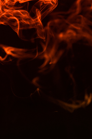 colorful smoke on dark backgroundの写真素材