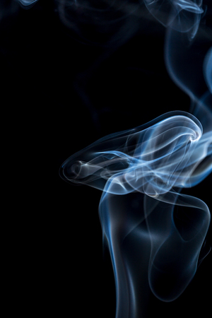 colorful smoke on dark backgroundの写真素材