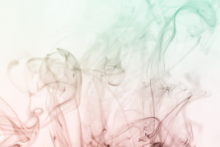 colorful smoke on dark backgroundの写真素材