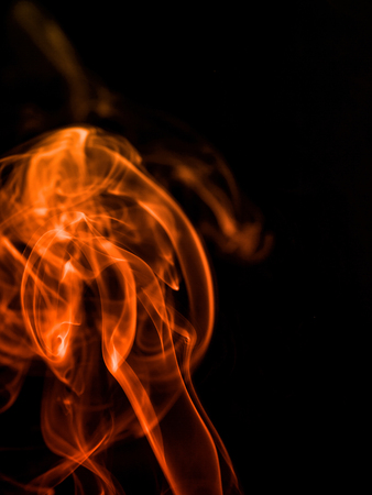 colorful smoke on dark backgroundの写真素材
