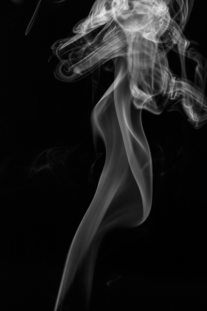 colorful smoke on dark backgroundの写真素材