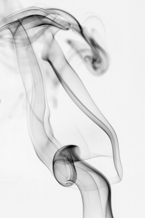 colorful smoke on dark backgroundの写真素材